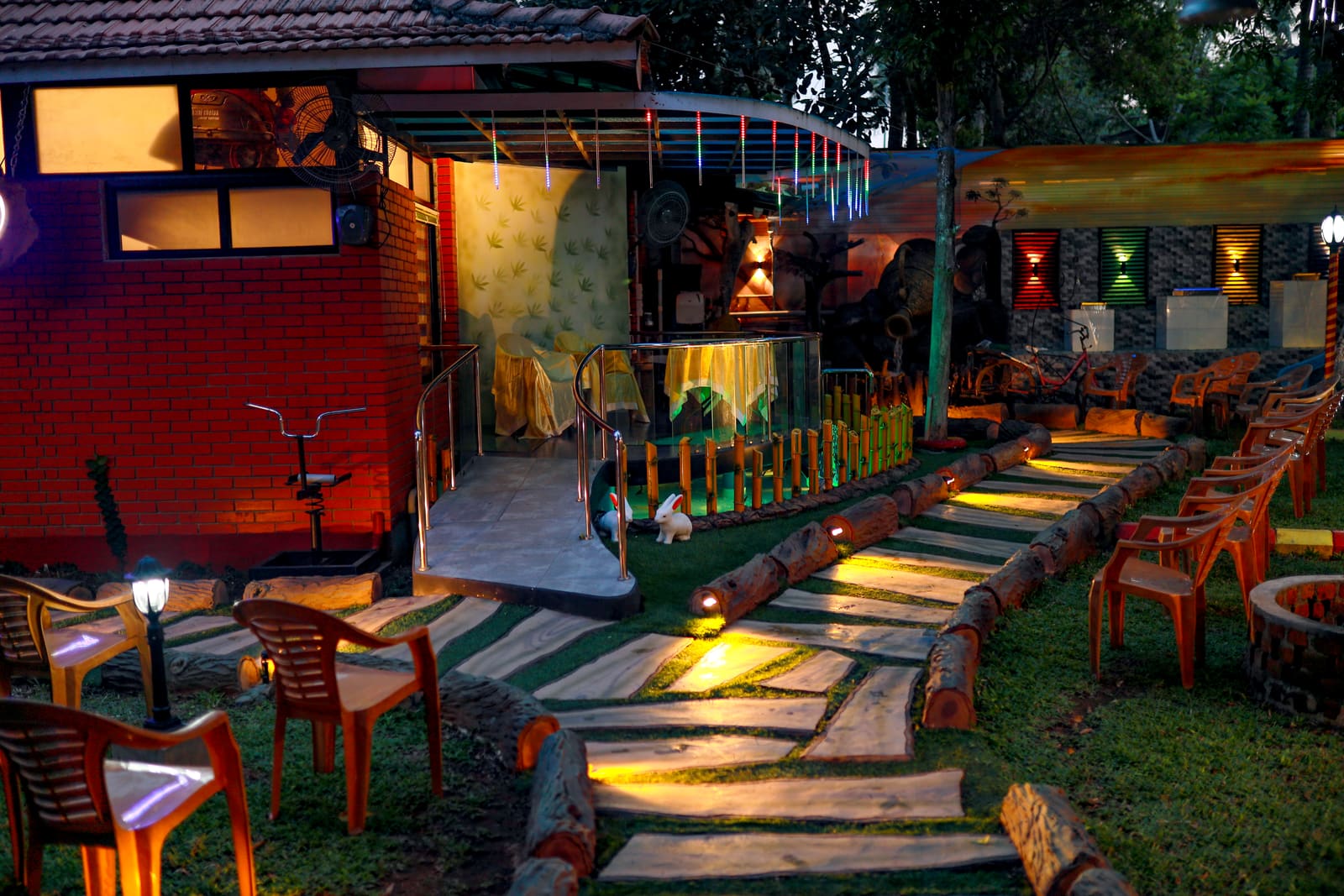 Lit garden walkway at dusk